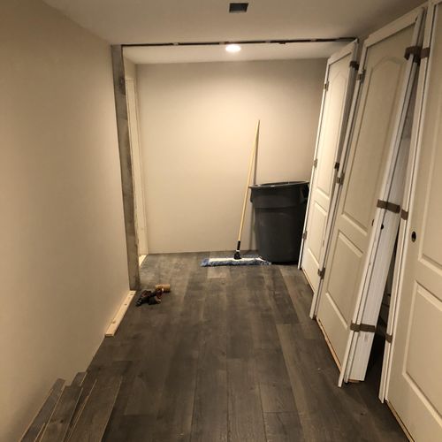 End of hallway flooring being completed