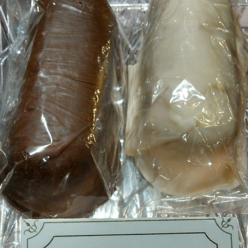 Chocolate covered Twinkies come with topping (nuts
