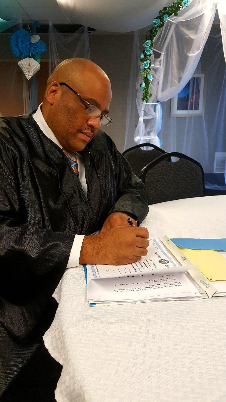Hon. David Singleton signing marriage license
