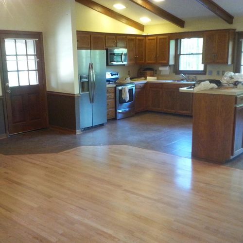 Hardwood floor refinished in natural tone, plus ce