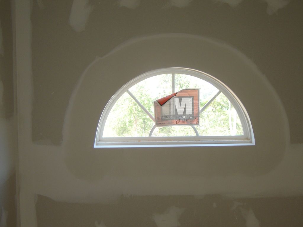 this is a new half arch window with arch bead .
