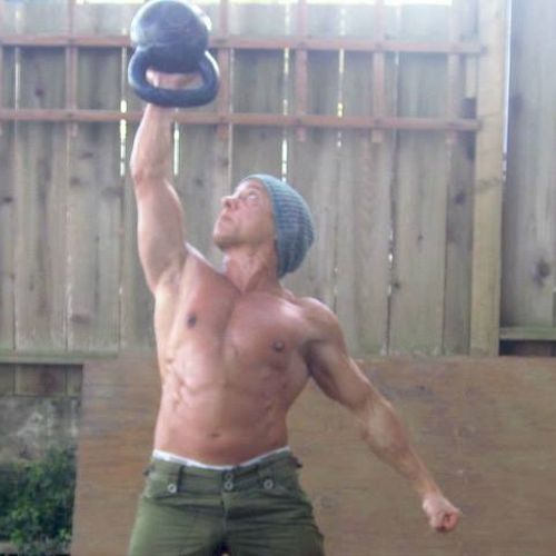 Me doing a palm press with a 53 lb kettlebell