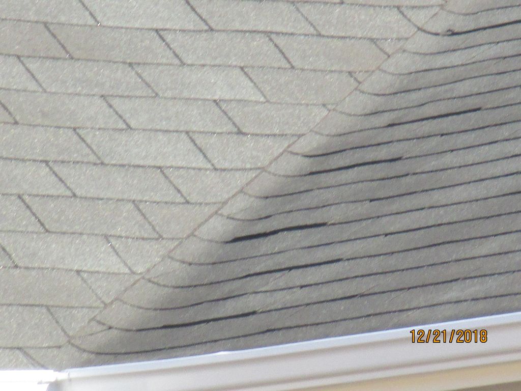 Reporting on raised shingles on a roof