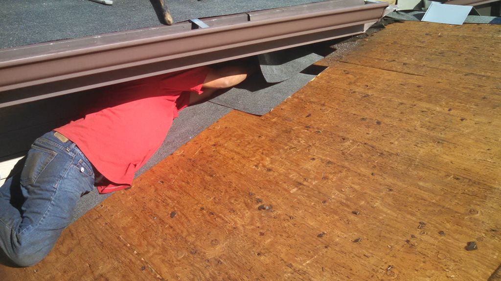 Installing ice shield above entry door to code.