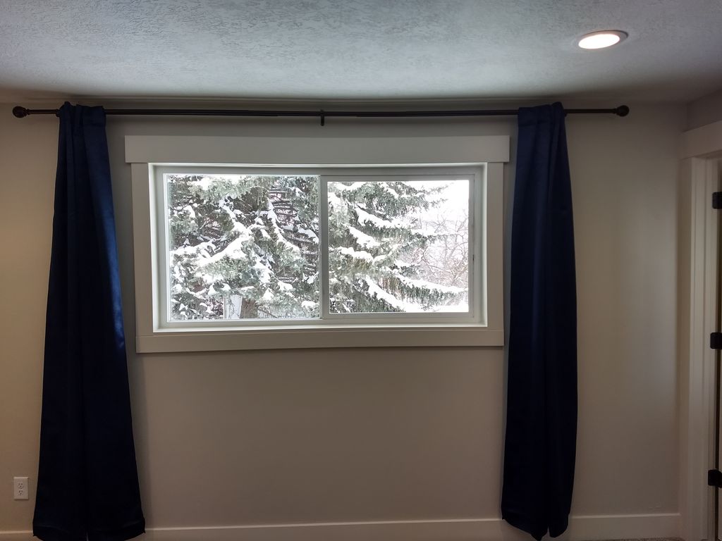 Window cased with large header.