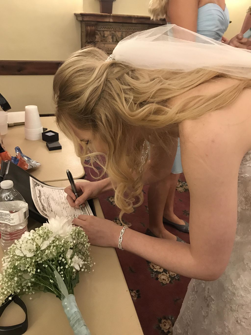 The gorgeous bride Mikayla signing her wedding lic