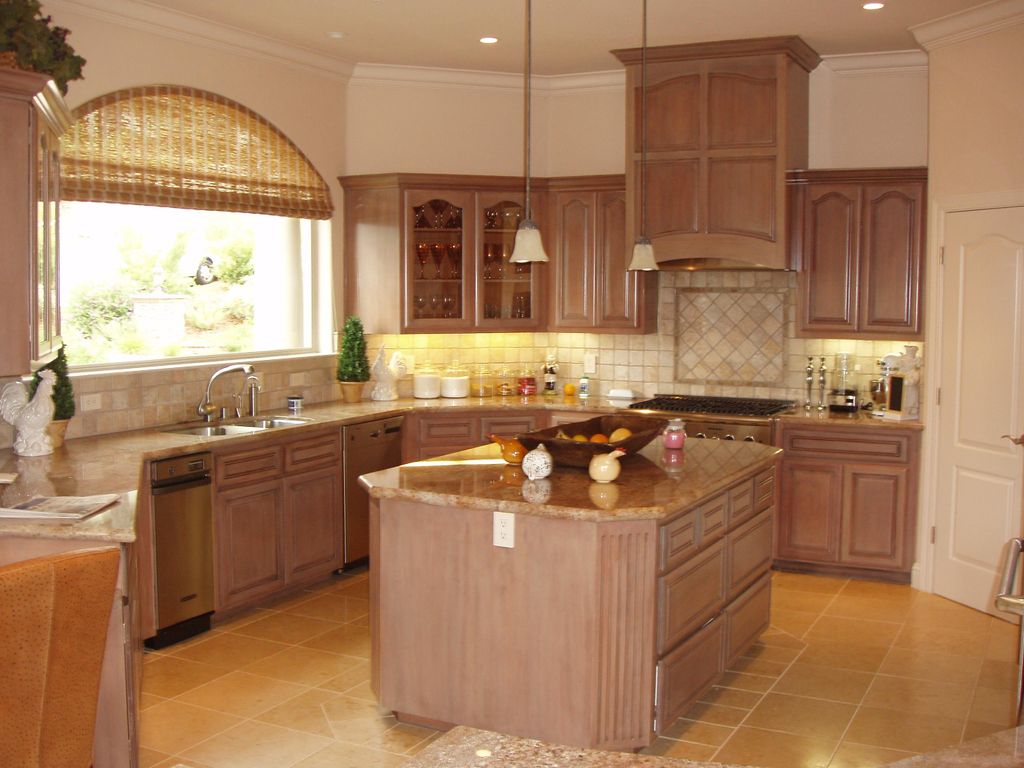 Carmel kitchen cabinet repaint in an antiqued faux