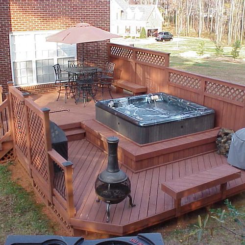 Two tiered deck with hot tub platform and benching