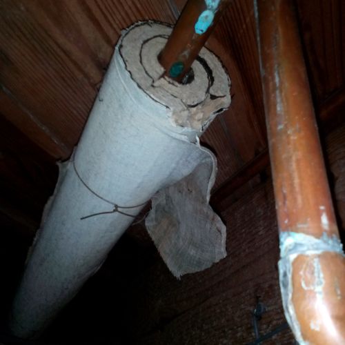 Asbestos containing pipe wrap in a residential hou