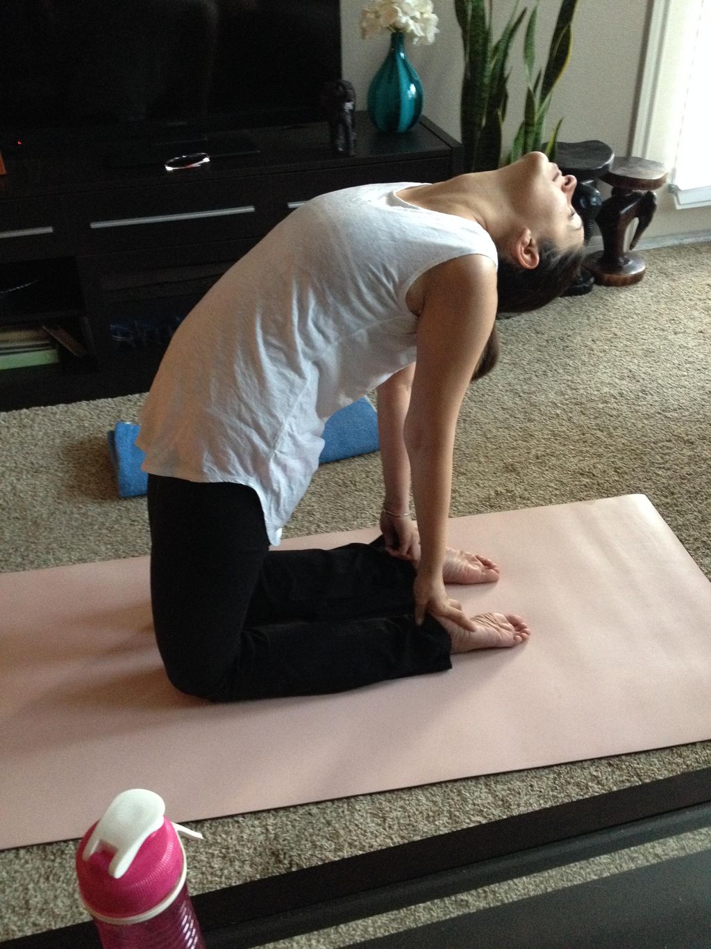 A client demonstrating Camel Pose.