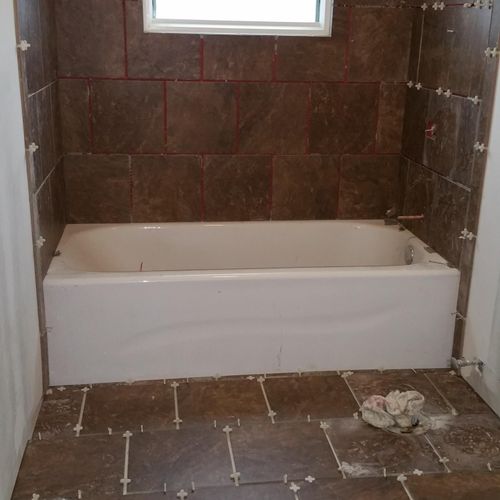 Tile shower surround for this newly remodeled bath