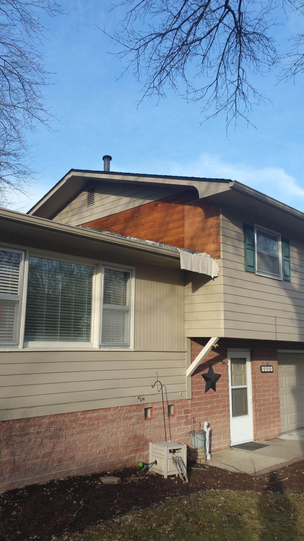 Project #1. Cedar siding replacement along roof