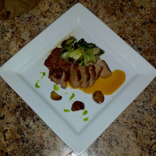 Pan seared duck breast with baby bok choy, garlic 