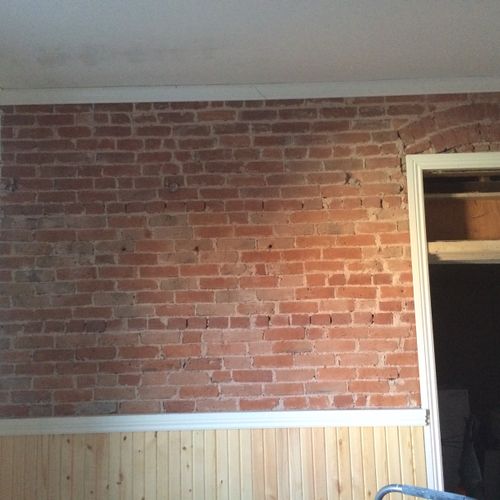 A fully exposed and sealed brick wall.