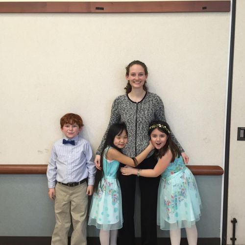 Picture with three students after their recital, w