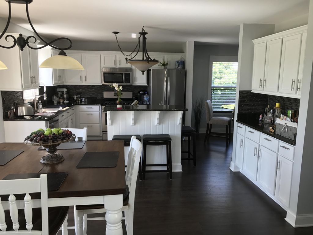 Painted kitchen cabinets, new island, flooring and