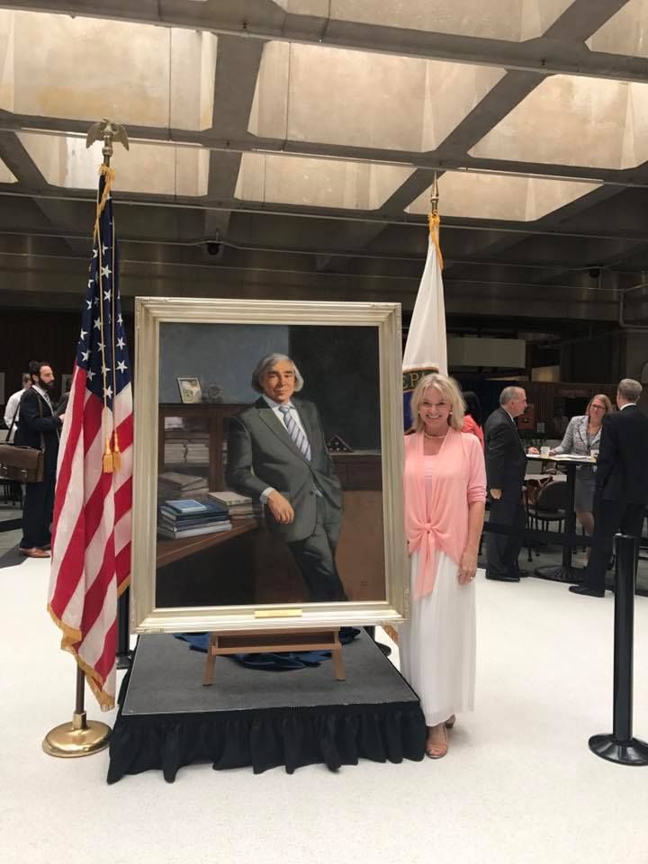 With Portrait of Ernest Moniz