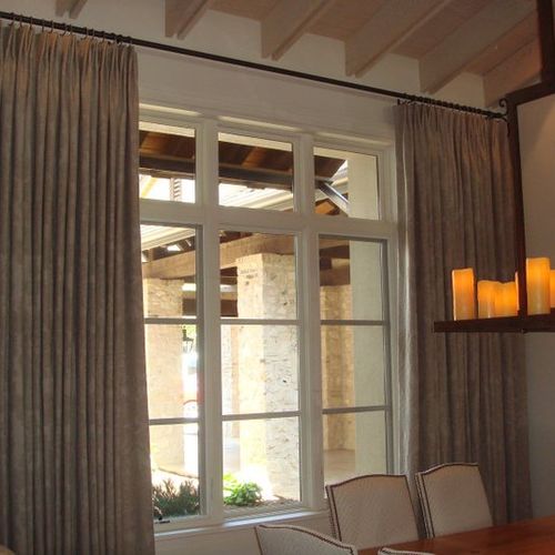Lovely linen drapes finish out this elegant dining