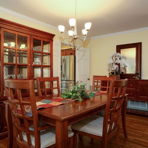 Dining room staged with homeowners furnishings