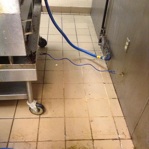 Commercial kitchen grease behind a fryer--"cleaned
