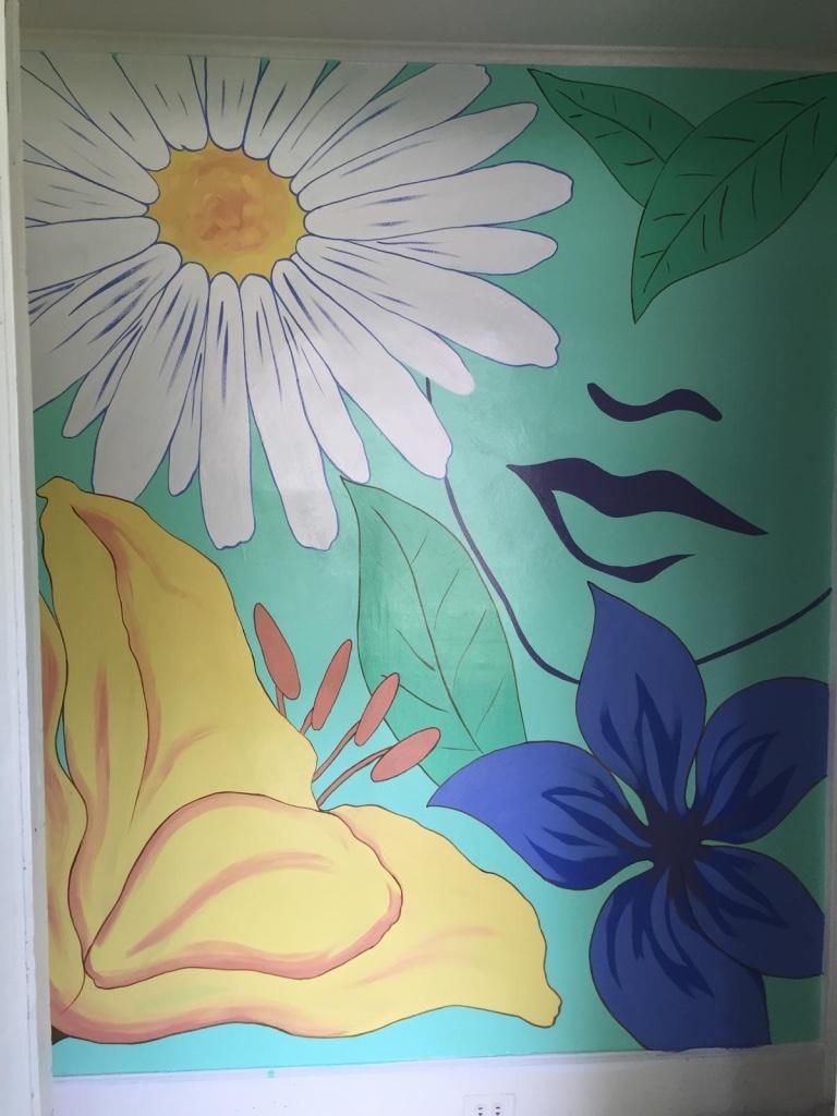 Flower with face for an entryway