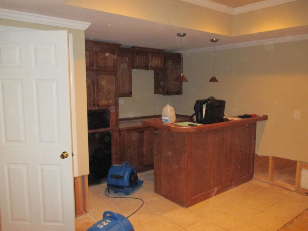 Before basement kitchen before water damage caused