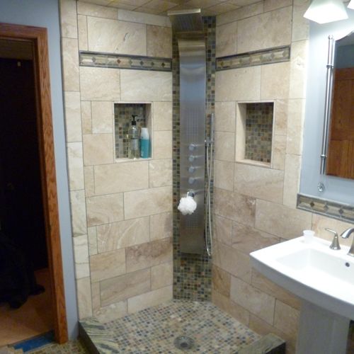 Custom shower with mixture of travertine and slate
