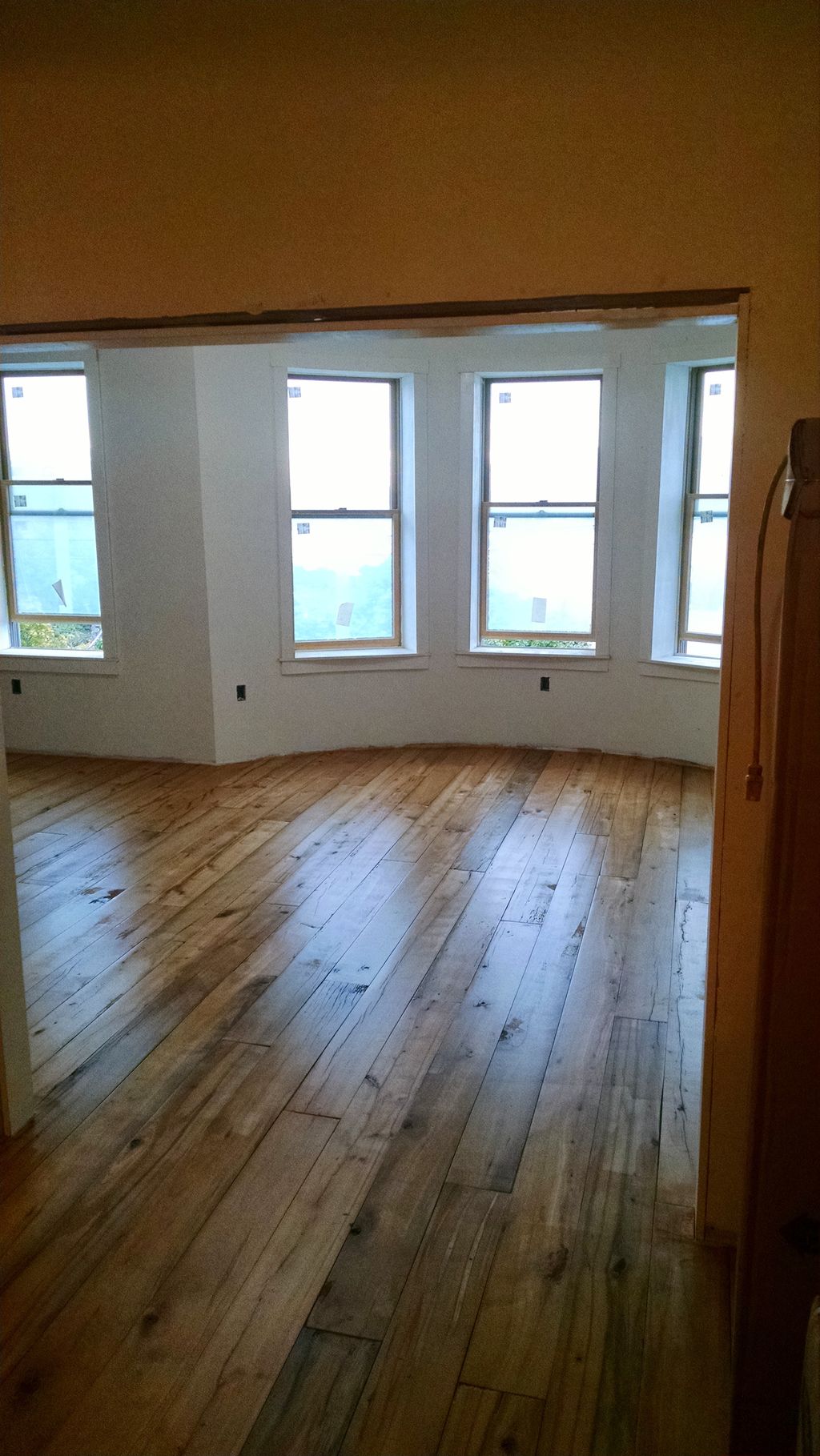 installed drywall,window trim and hardwood floorin