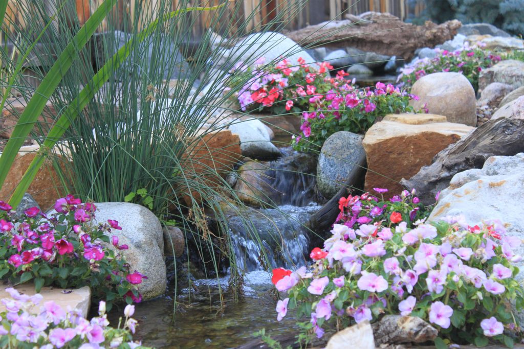 Waterfalls into a pond.......lovely!