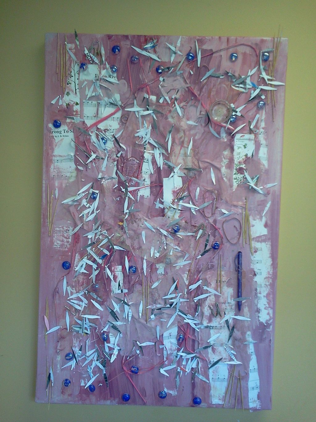 This mixed medium piece on a stretched canvas is a
