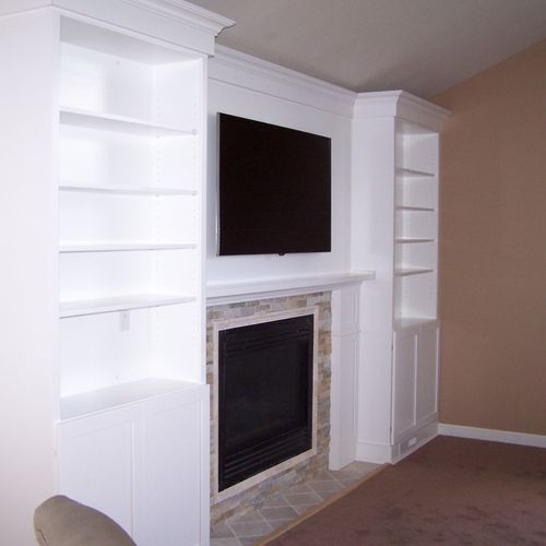Fireplace mantle, bookshelves, wall & floor tile