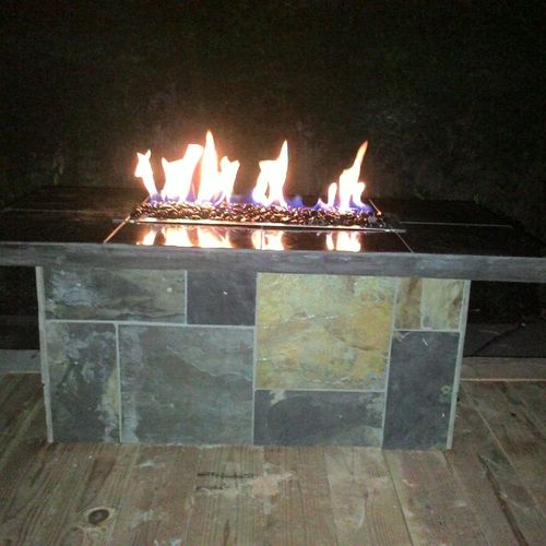 Custom natural gas fire-pit built of slate and gra