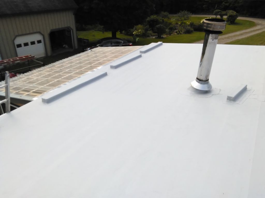 Stripped shingles and installed 1" Insulation and 
