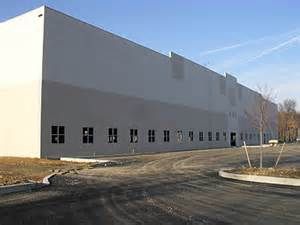 Exterior warehouse: walls painted, also windows an