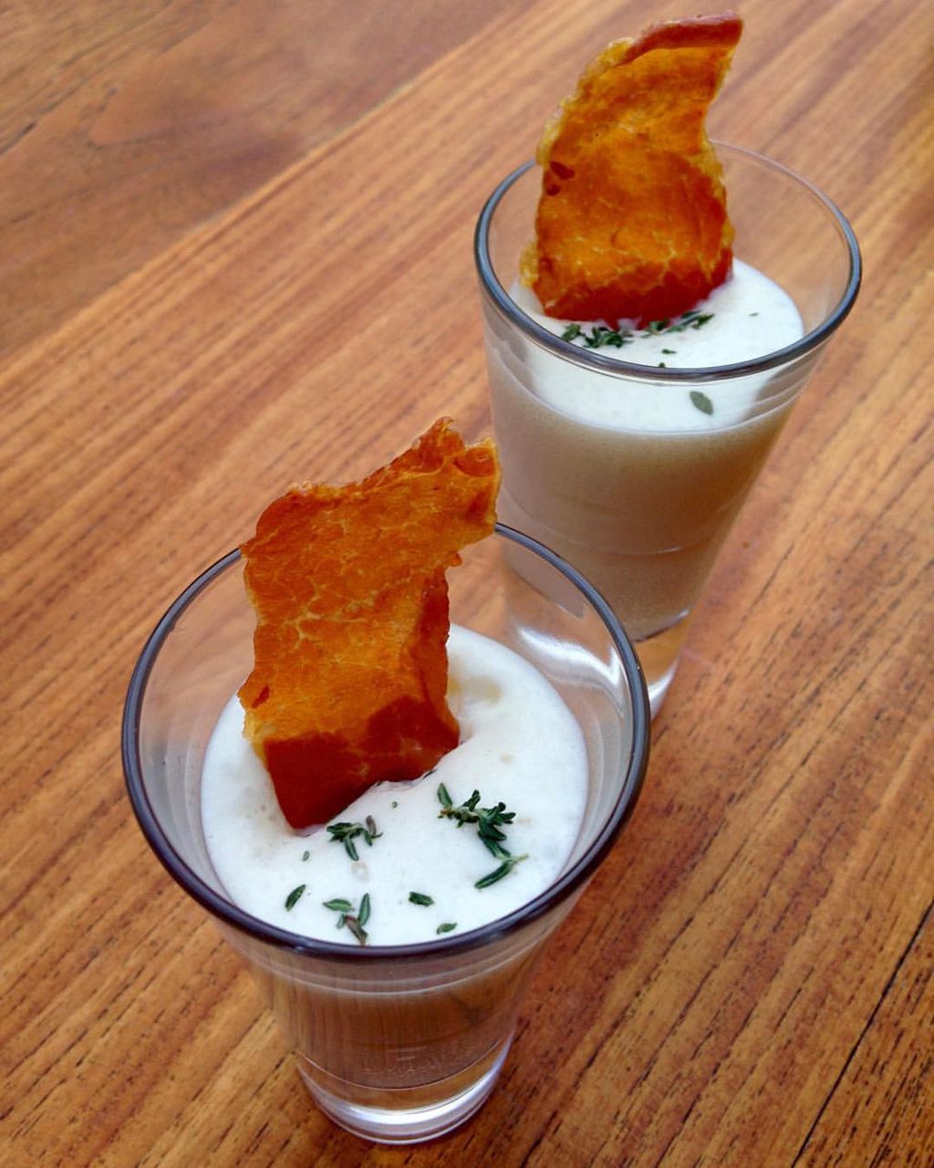 Onion cream foam with crispy prosciutto and fresh 