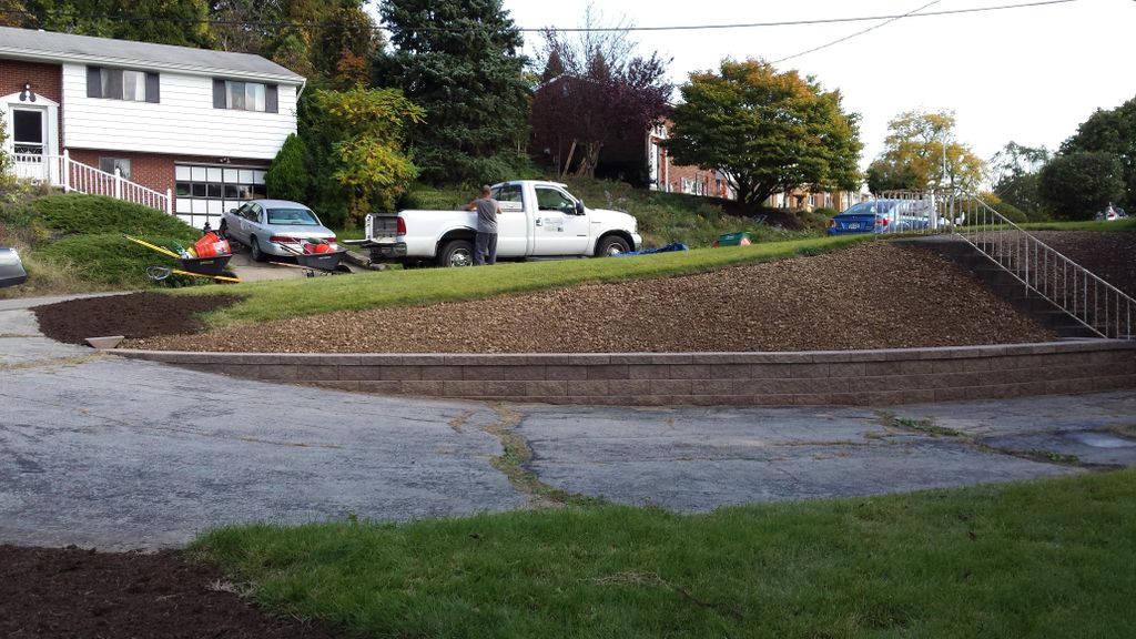 Shrub removal & Versa Lok wall installation after