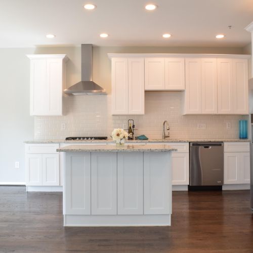 White kitchen cabinets with LED lighting, island, 