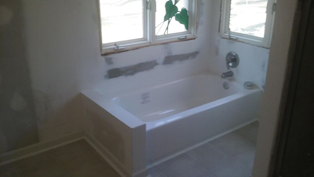 TUB INSTALL AND DRYWALL REPAIR.