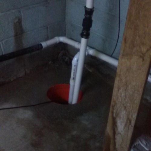 Completed sump pump pit and installation of piping