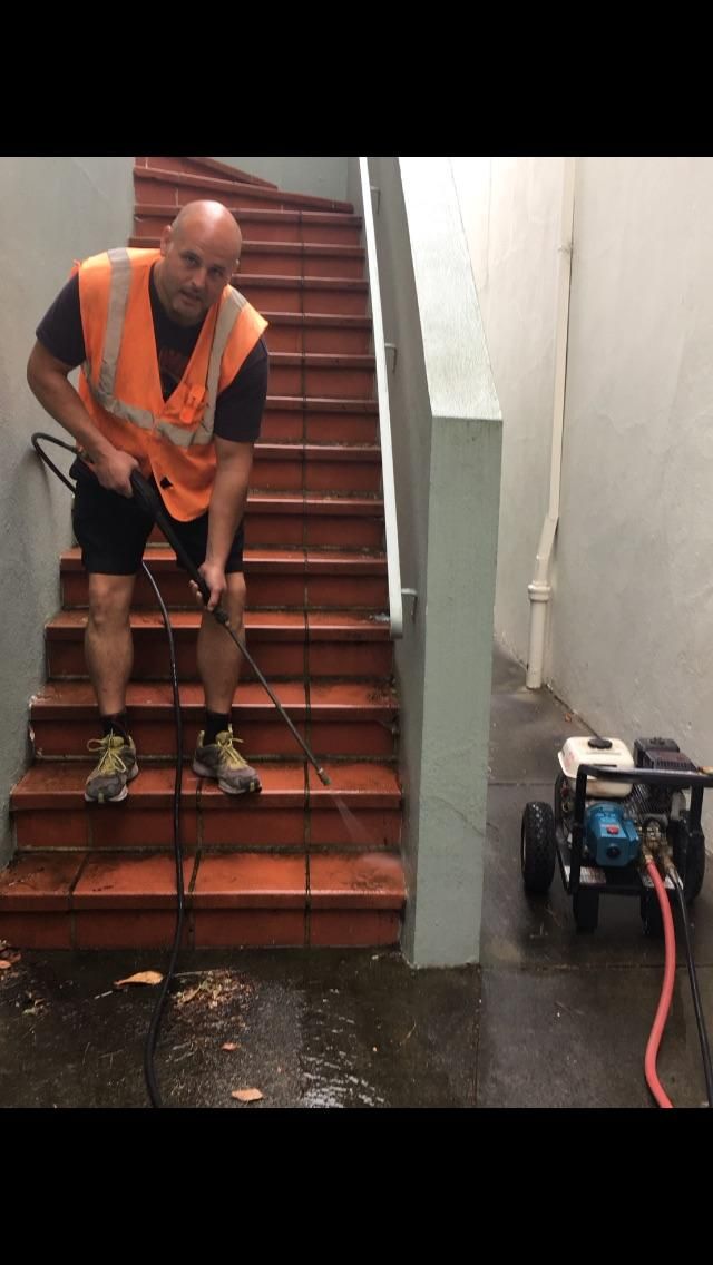 Al cleaning Stairs in the City