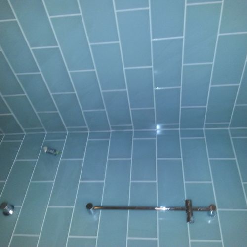 Glass tile in steam shower.