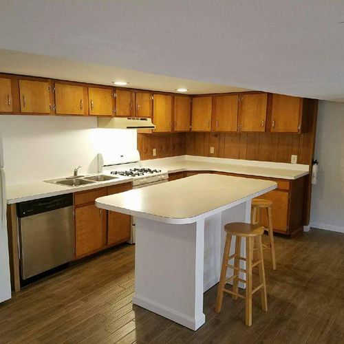 kitchen remodel in basement apartment with wood lo