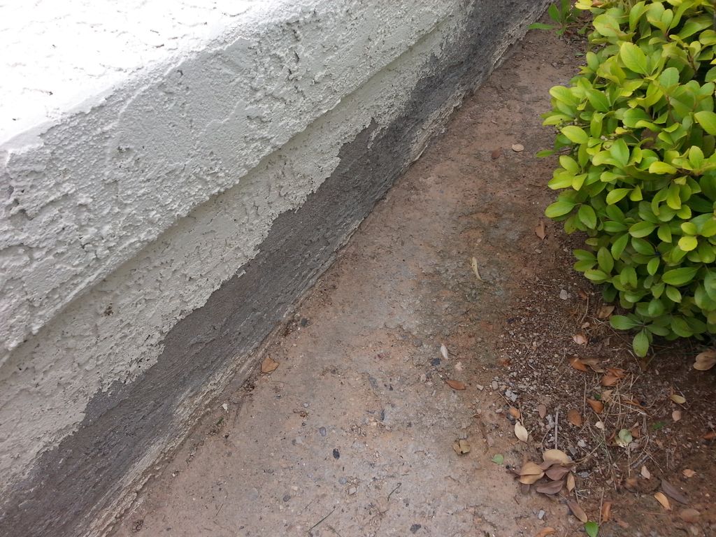 Repaired stucco fence