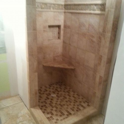 Custom tile shower. with shower seat and niche.