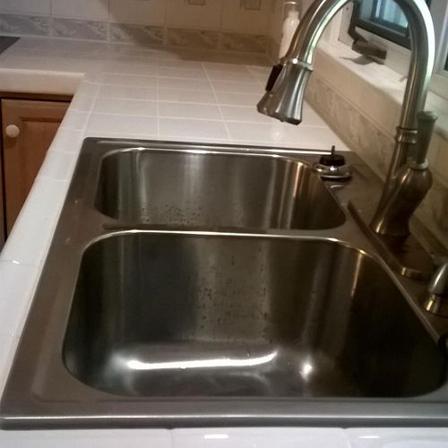 New tiled countertop, stainless steel sink, dispos