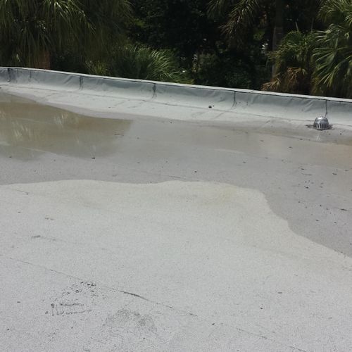 Ponding of water on flat roof system that was not 