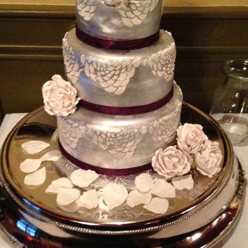 Three tiered modern wedding cake with handmade sug