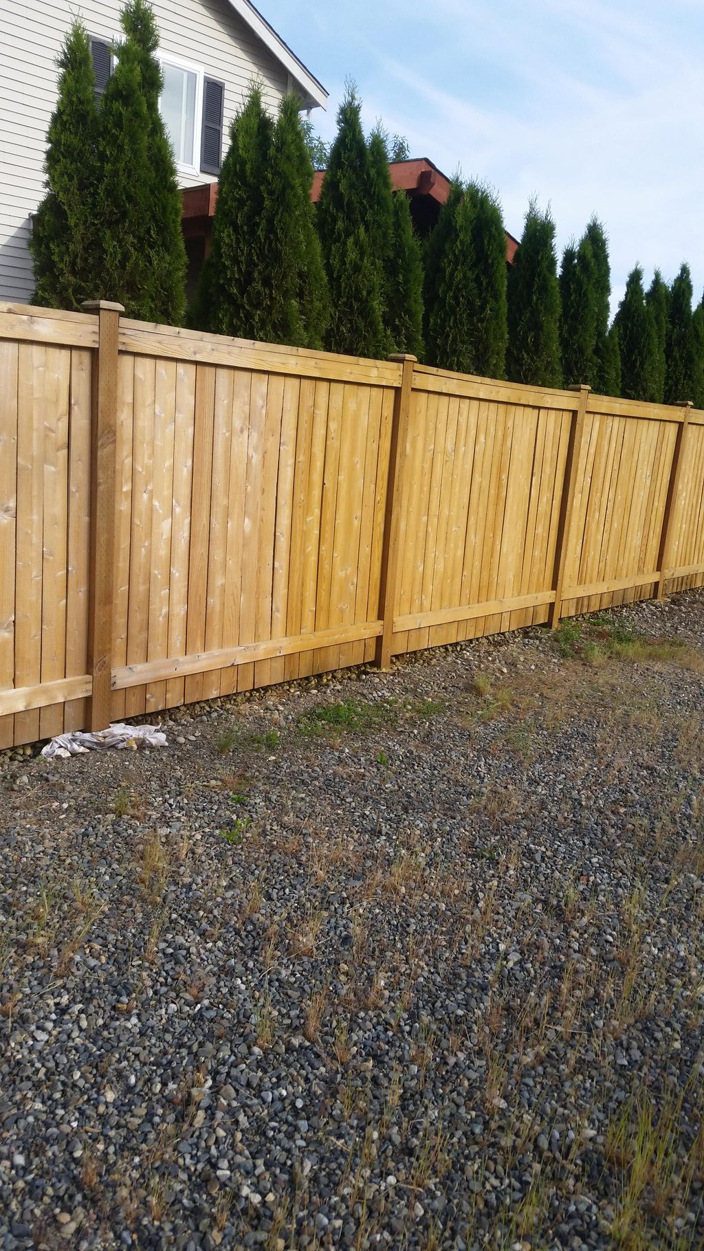 Sealing and coating one of our customers fence.