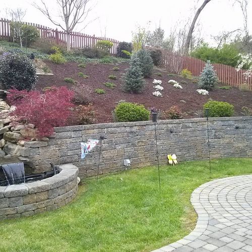 Large bank of full-color landscaping and retaining