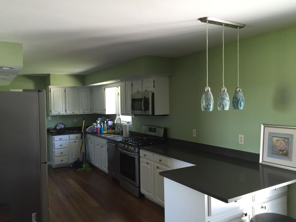 Painted cabinets and walls also some drywall work 